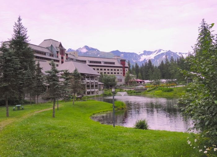 A castle on top of a lush green field Description automatically generated