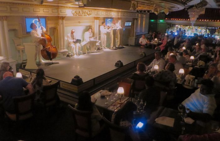 A crowd of people in a room Description automatically generated