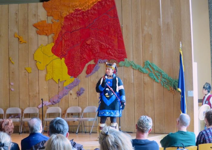 A group of people on a stage Description automatically generated