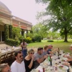 A group of people sitting at a table Description automatically generated