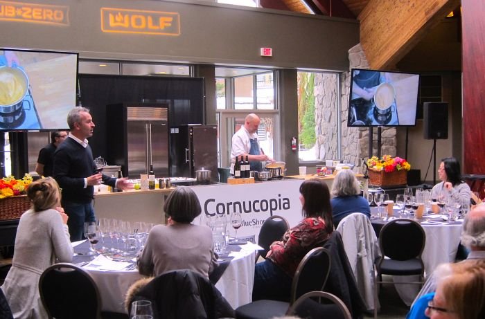 A group of people sitting at a table in a restaurant Description automatically generated