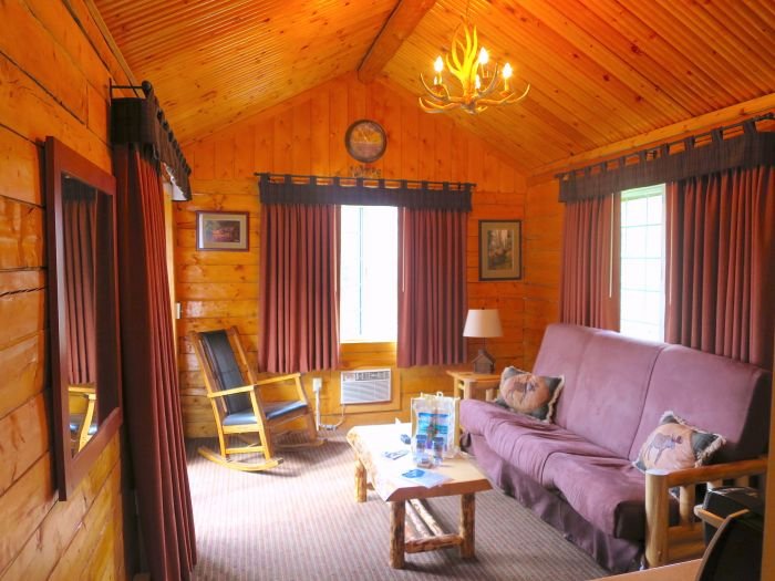 A living room filled with furniture and a fireplace Description automatically generated