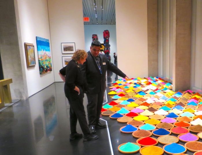 A person standing in a room Description automatically generated