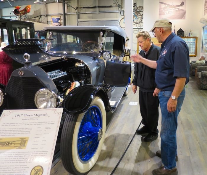 A person standing next to a truck Description automatically generated