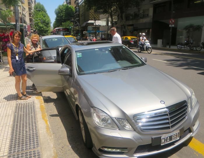 A police car parked on a city street Description automatically generated