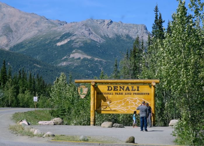 A sign on the side of a mountain road Description automatically generated