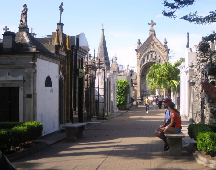 A statue of a person riding on the back of a church Description automatically generated