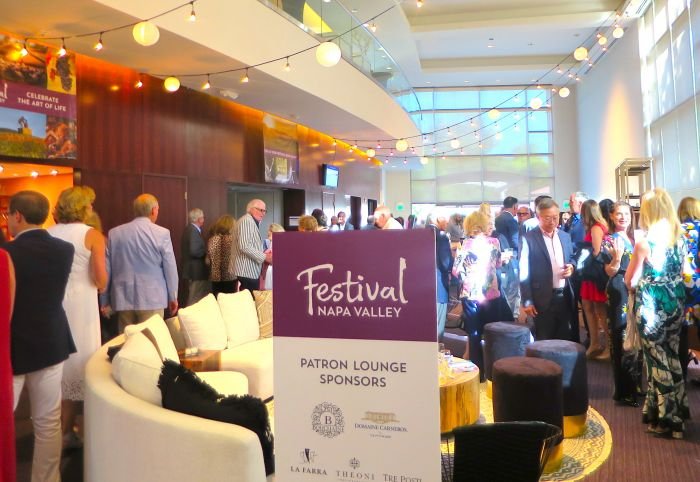 A group of people sitting at a table in a restaurant Description automatically generated