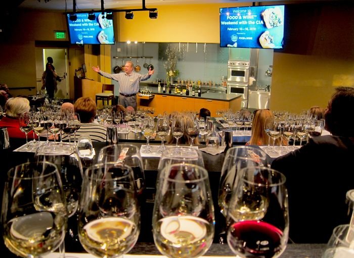 A picture containing indoor, table, person, wall Description automatically generated