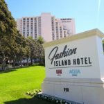 A white sign with black text Description automatically generated