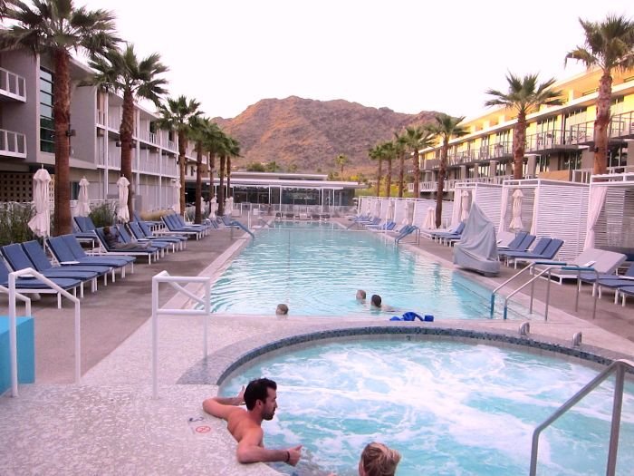 A group of people swimming in a pool of water

Description automatically generated