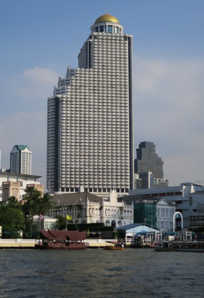 A large body of water with a city in the background Description automatically generated