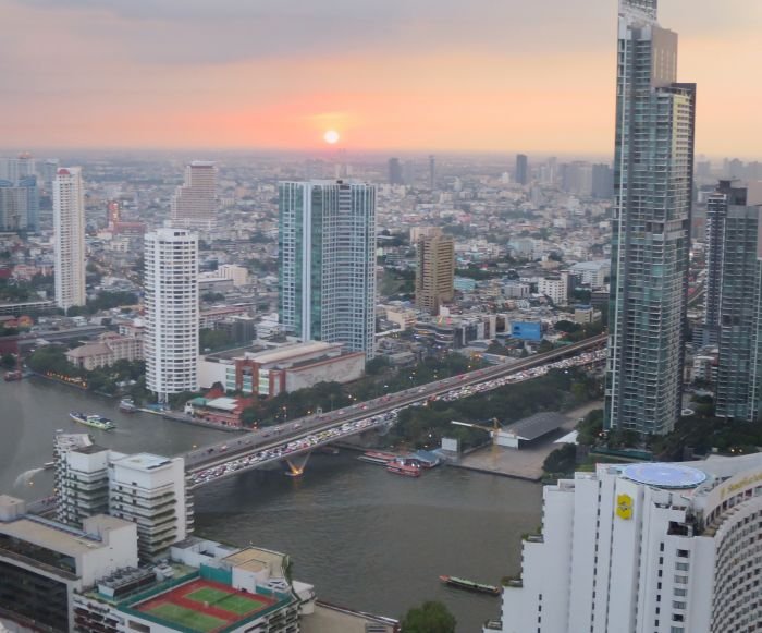 A large body of water with a city in the background

Description automatically generated