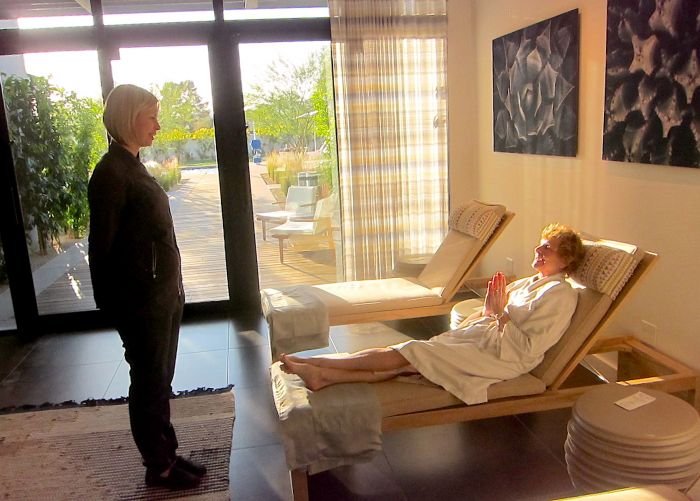 A person sitting at a table in front of a window

Description automatically generated