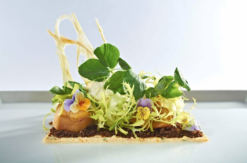 A piece of cake on a table Description automatically generated