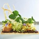 A piece of cake on a table Description automatically generated