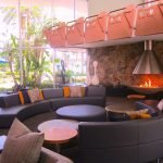 A room filled with furniture and a large window Description automatically generated