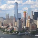 A body of water with a city in the background Description automatically generated